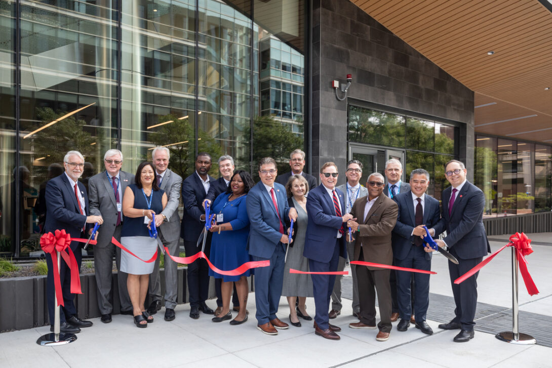 UIC and UI Health leaders and special guests cut the ribbon outside the Specialty Care Building Sept. 14, 2022.