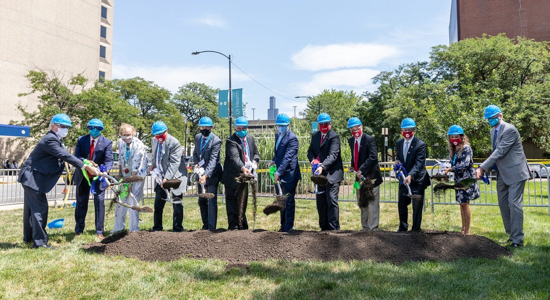 From left, Mike O'Keefe of Ankura, Vice Chancellor for Health Affairs Robert Barish, Sallie and Bruce Pasquinelli, Trustee Ramon Cepeda, Trustee Stuart King, IL Senate Pres. Don Harmon, UIC Chancellor Michael Amiridis, University of Illinois System President Timothy Killeen, College of Medicine Dean Mark Rosenblatt, UIC Student Trustee Jocelyn Bravo and CEO of UI Health Michael Zenn break ground for the Outpatient Surgery Center on Thursday, Aug. 13, 2020, at UI Health in Chicago, Ill. (Joshua Clark/University of Illinois Chicago)