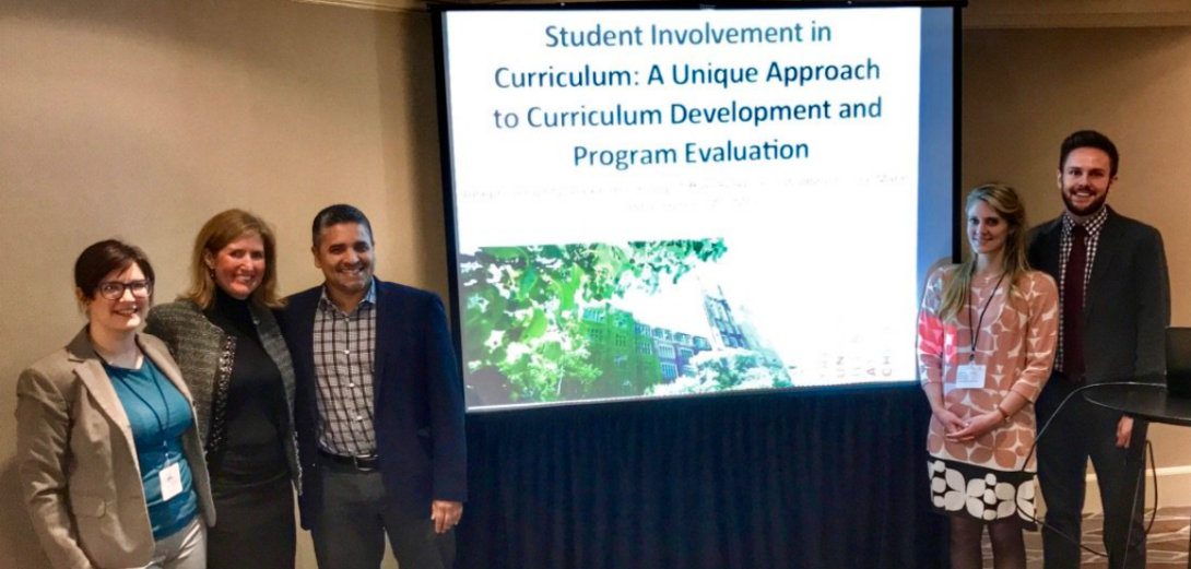 Student leaders presenting at the AAMC Central Group on Educational Affairs in 2016 describing the UICOM Student Curricular Board alongside advisors former Dean Abbas Hyderi and Julie Mann (2016)