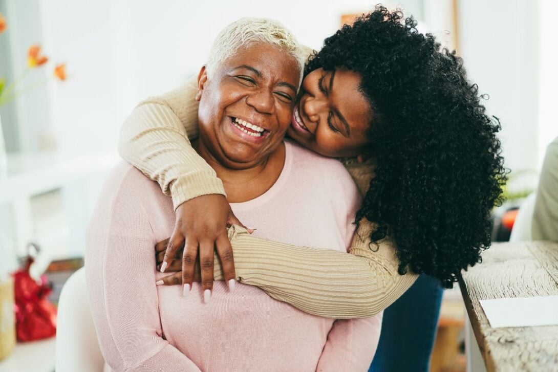 Daughter hugging her mum